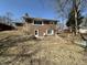 View of backyard with a door leading into the brick home and a patio area at 5850 Paradise Ln, Martinsville, IN 46151