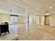 Large finished basement with tiled floor, exposed ductwork and support beams at 5850 Paradise Ln, Martinsville, IN 46151