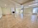 Large basement area features a tile floor, fireplace and access to an exterior door at 5850 Paradise Ln, Martinsville, IN 46151