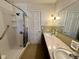 This bathroom features a shower and double sinks with a large mirror at 5850 Paradise Ln, Martinsville, IN 46151