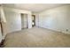 An empty bedroom features carpeted floors, a double door closet, and a connecting doorway at 5850 Paradise Ln, Martinsville, IN 46151
