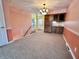 Open dining area offering great lighting with a carpet floor leading to the kitchen at 5850 Paradise Ln, Martinsville, IN 46151