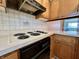 Eat-in kitchen features tiled backsplash, and a view to the living room at 5850 Paradise Ln, Martinsville, IN 46151