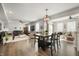 Open-concept living space featuring a dining area, living room, and hardwood floors throughout the home at 603 Blarney Dr, Pendleton, IN 46064