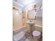 Bathroom showcasing a shower-tub combo, pedestal sink, medicine cabinet, and toilet at 613 Barrett St, Danville, IN 46122