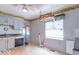 A functional kitchen with cabinets, a sink, and a window at 613 Barrett St, Danville, IN 46122