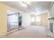 A bright living room features a brick fireplace and ceiling fan at 613 Barrett St, Danville, IN 46122