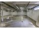 Large, unfinished basement with a few small windows and exposed piping at 6204 S Madison Ave, Indianapolis, IN 46227