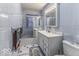 Traditional bathroom featuring a shower/tub combo and vanity with storage at 6204 S Madison Ave, Indianapolis, IN 46227