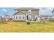 Spacious backyard with healthy lawn, patio furniture, and well-maintained fence at 6615 Aberdeen Dr, McCordsville, IN 46055