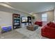 Spacious living room features a large area rug, red sofas, and a stylish coffee table at 6615 Aberdeen Dr, McCordsville, IN 46055