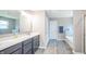 Bathroom with a double vanity and a separate tub and shower at 6699 Dunkirk Dr, McCordsville, IN 46055