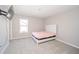 Bedroom with neutral walls and carpet and a white bed frame at 6699 Dunkirk Dr, McCordsville, IN 46055