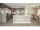 Modern kitchen featuring a center island, stainless steel appliances, and gray cabinets at 6699 Dunkirk Dr, McCordsville, IN 46055