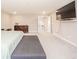 A spacious main bedroom featuring neutral tones, carpet, and a large television at 6699 Dunkirk Dr, McCordsville, IN 46055