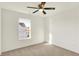 Bright bedroom with soft gray carpet, ceiling fan and a single window at 6895 Honeysuckle Way, Pendleton, IN 46064