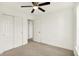 Bright bedroom with soft gray carpet, ceiling fan and double closets at 6895 Honeysuckle Way, Pendleton, IN 46064