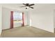 Bright bedroom with a window and neutral-colored carpeting at 6895 Honeysuckle Way, Pendleton, IN 46064