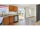 Galley kitchen with stainless steel appliances and a sink overlooking an outdoor area at 6895 Honeysuckle Way, Pendleton, IN 46064