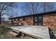 Inviting back patio with a dining set, perfect for outdoor entertaining, accessible through elegant glass doors at 7089 W Us Highway 36, Danville, IN 46122
