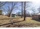 Backyard featuring outbuilding and mature trees at 7089 W Us Highway 36, Danville, IN 46122