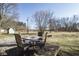 Backyard patio with outdoor dining furniture; an inviting space for relaxing and entertaining guests at 7089 W Us Highway 36, Danville, IN 46122