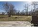 View of the expansive, tree-lined backyard from a wooden deck at 7089 W Us Highway 36, Danville, IN 46122