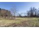A vast green backyard offers ample space for outdoor activities and serene relaxation at 7089 W Us Highway 36, Danville, IN 46122