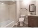 Well-lit bathroom with updated vanity, modern fixtures, and shower-tub combo at 7089 W Us Highway 36, Danville, IN 46122