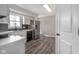Bright kitchen with white cabinets, stainless steel appliances, and modern backsplash at 7089 W Us Highway 36, Danville, IN 46122