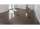 Bright living room featuring hardwood floors, white trim, and double doors to the exterior at 7089 W Us Highway 36, Danville, IN 46122