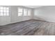 Living room featuring hard wood floors, natural light, and freshly painted walls at 7089 W Us Highway 36, Danville, IN 46122