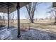 Enjoy this pastoral view from the covered porch that provides a great place to relax at 7089 W Us Highway 36, Danville, IN 46122