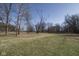 Large yard with mature trees and sunshine at 7089 W Us Highway 36, Danville, IN 46122