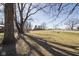 Spacious yard surrounded by mature trees, offering a serene and expansive outdoor area at 7089 W Us Highway 36, Danville, IN 46122