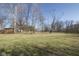 Large yard featuring mature trees and late winter grass at 7089 W Us Highway 36, Danville, IN 46122