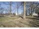 Large yard with mature trees and green space, offering a serene and expansive outdoor area at 7089 W Us Highway 36, Danville, IN 46122