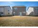 Backyard view features a spacious lawn and patio at 737 Oxford Ln, Danville, IN 46122