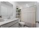 Bright bathroom features a single vanity with quartz countertops and decor at 737 Oxford Ln, Danville, IN 46122