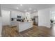 Bright kitchen with white cabinetry, stainless steel appliances, and a spacious island perfect for entertaining at 737 Oxford Ln, Danville, IN 46122