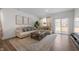 Bright living room featuring a stylish sofa, coffee table, and decor, creating an inviting atmosphere at 737 Oxford Ln, Danville, IN 46122