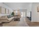 Cozy living room featuring plush seating, a decorative rug, modern entertainment center, and hardwood flooring at 737 Oxford Ln, Danville, IN 46122