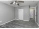 Bedroom features wood-look floors, a closet, neutral walls, and a ceiling fan at 741 Southfield Ct, Indianapolis, IN 46227