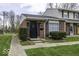 Charming brick townhouse with neat landscaping and a black front door at 741 Southfield Ct, Indianapolis, IN 46227