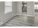 Bright living room features wood-look floors and a window at 741 Southfield Ct, Indianapolis, IN 46227