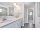 Modern bathroom with double vanity, quartz countertop, and tiled shower at 8445 Morgan Ln, Zionsville, IN 46077