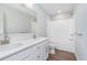 This bathroom includes double sinks, white cabinets, a shower and bath with a tub at 8445 Morgan Ln, Zionsville, IN 46077