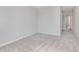 This bedroom includes neutral walls, soft carpet, and a doorway to an adjacent room or hallway at 8445 Morgan Ln, Zionsville, IN 46077