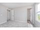 This bedroom features neutral walls, soft carpet, and two closets for ample storage space at 8445 Morgan Ln, Zionsville, IN 46077