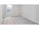 This bright bedroom features carpet, white walls, and a window with neighborhood views at 8445 Morgan Ln, Zionsville, IN 46077